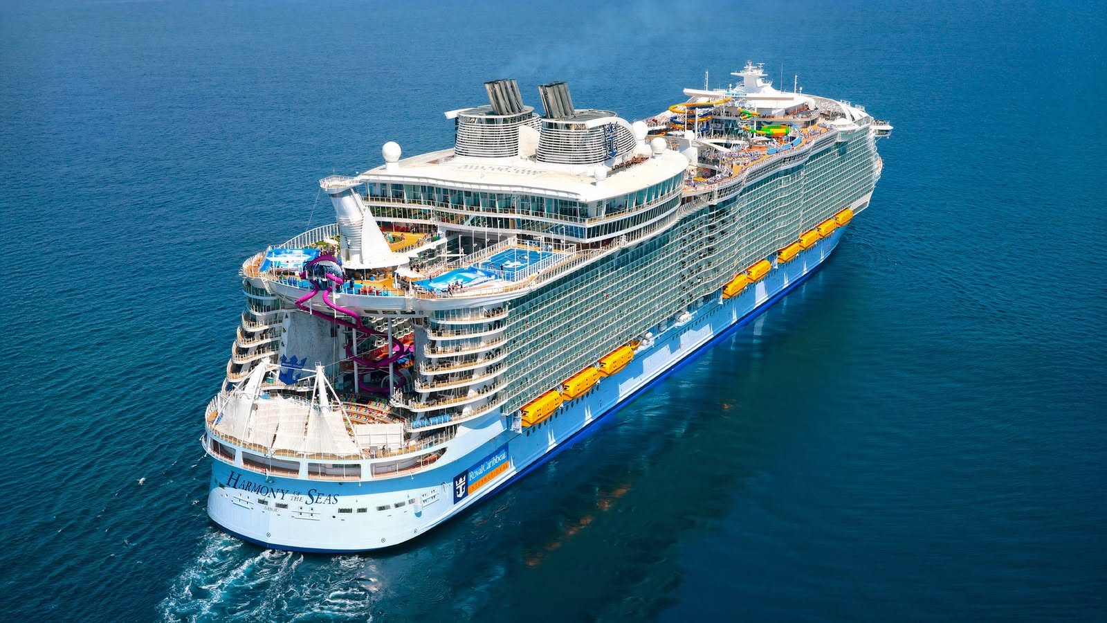 Harmony of the Seas cruise ship sailing through turquoise ocean water